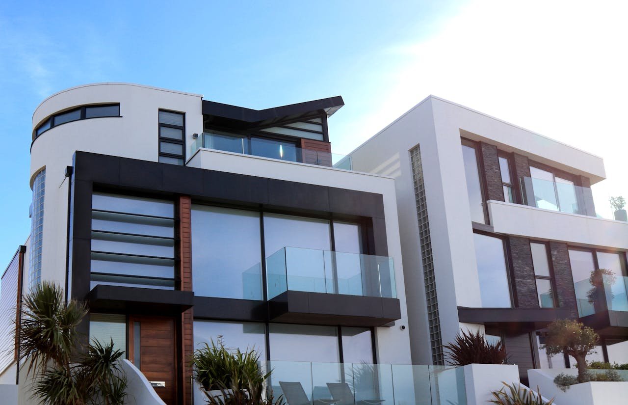 Services-03 Contemporary luxury home with glass balconies in Poole, UK, showcasing modern architectural design.